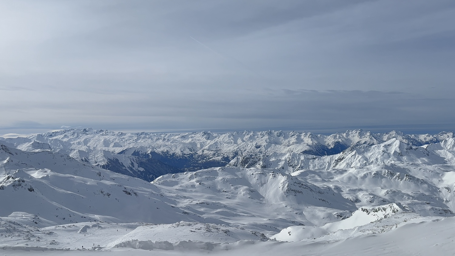 A large range of snow covered mountains and valleys